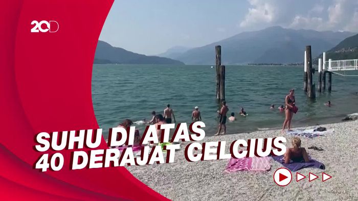 Masih Dinaungi Gelombang Panas, Warga Italia Ramai Ngadem di Danau